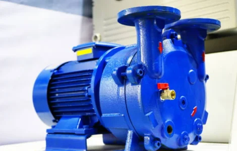 A blue electric pump resting on a white surface, ready for use in pumping fluids used for industrial applications.