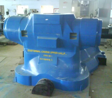An external casting upper half component in blue, produced in a manufacturing facility for various applications