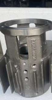 An industrial Submersible Hexagon Pump for metal casting machine producing a substantial metal part.