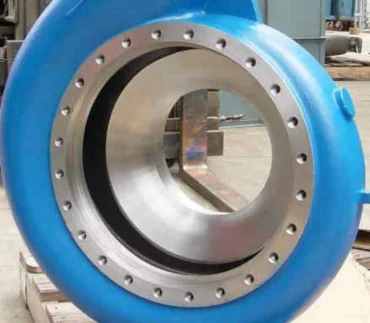 A blue valve mounted on a stand positioned in front of a machine, ready for precise control and regulation.