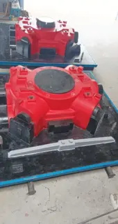 Best mechanical equipment manufacturing company in Coimbatore A pair of red and black mechanical devices on the floor, made in a foundry pattern manufacturing factory